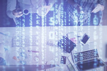 Double exposure of man and woman working together and data theme hologram drawing. Computer background. Top View.