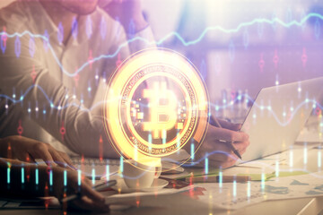 Fototapeta premium Double exposure of man and woman working together and crypto finance theme hologram. Blockchain business concept. Computer background.