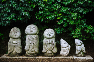 Japanese monk statues on street in Arashiyama, Kyoto, Japan.