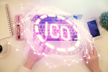 Double exposure of woman hands working on computer and blockchain theme hologram drawing. Top View....