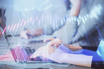 Multi exposure of woman hands typing on computer and financial chart hologram drawing. Stock market analysis concept.