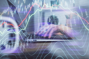 Double exposure of woman hands typing on computer and forex chart hologram drawing. Stock market invest concept.