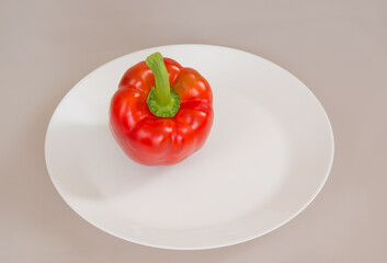 Red bell pepper on a white plate