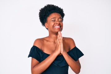 Young african american woman wearing casual clothes begging and praying with hands together with hope expression on face very emotional and worried. begging.