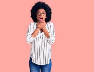 Young african american woman wearing casual clothes and glasses shouting and suffocate because painful strangle. health problem. asphyxiate and suicide concept.