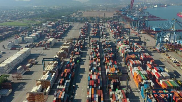 aerial view from modern industrial port with containers from above. It is an import and export cargo port where is a part of shipping dock
