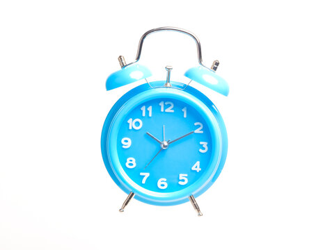 A levitation concept picture of table clock isolate in white background. Time management and success planning concept