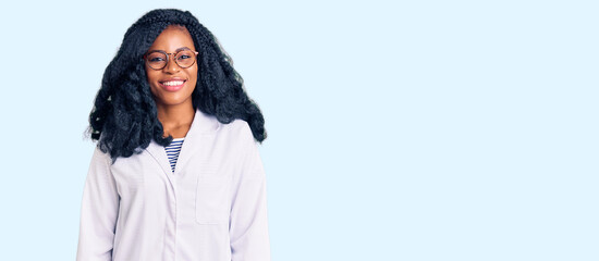 Beautiful african american optician woman with optometry glasses looking positive and happy...