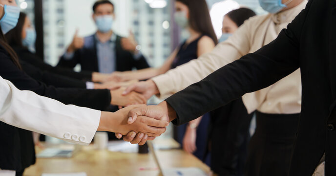 business team show teamwork with having handshake together