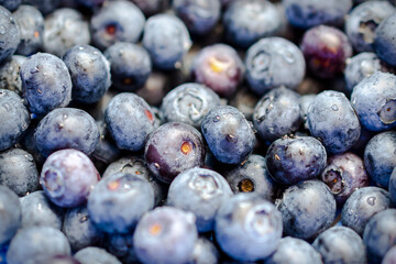 Close up view of blueberries washed with water.