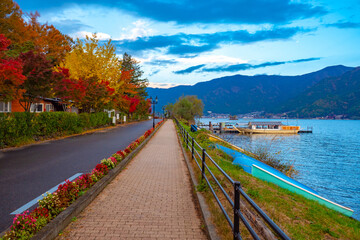 Japan. Kawaguchiko Waterfront. Picturesque houses on the shore of lake Kawaguchiko. Mountain landscape of Japan. Autumn in Japan. Life in the town of Kawaguchiko. The Japanese tour.