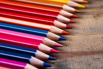 color pencil on wood background, back to school concept

