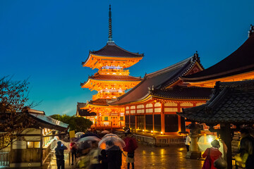 Fototapeta premium Japan. Kyoto. Temple of pure water in Japan. Kiyomizu Dera Temple. Buddhist temple with evening illumination. Rainy evening in Kyoto. Traditional Japanese architecture. Sights Of Japan.