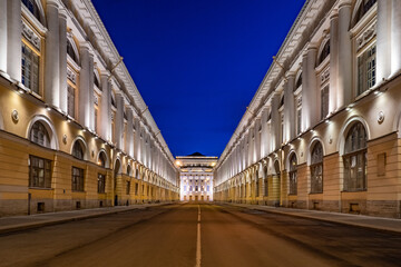 Fototapeta na wymiar Evening Saint Petersburg. Russia. Street Of The Architect Rossi. Streets Of St. Petersburg. Evening in St. Petersburg. City street with classic buildings with evening lighting. Alexandrinsky theater.