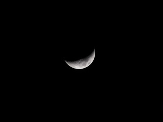 Obraz na płótnie Canvas Waxing crescent moon.