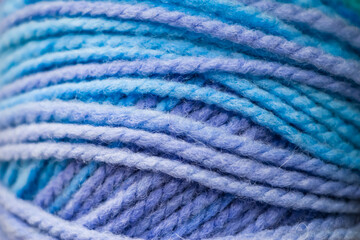 Texture of blue soft woolen threads for knitting.