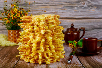 Lithuanian traditional layered cake sakotis with tea.
