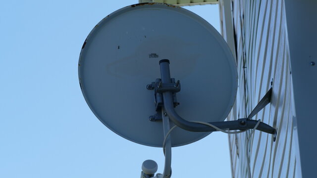 parabolic antenna on the wall of the house