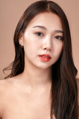 Fototapeta premium Face closeup of Asian beauty woman with natural makeup, cosmetic and plastic surgery concept, Isolated mocha brown background