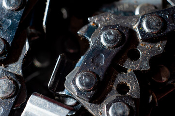 Chainsaw chain for cutting firewood close-up, macro shot