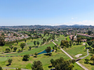 Fototapeta na wymiar Aerial view of golf in upscale residential neighborhood, Rancho Bernardo, San Diego County, California. USA. 