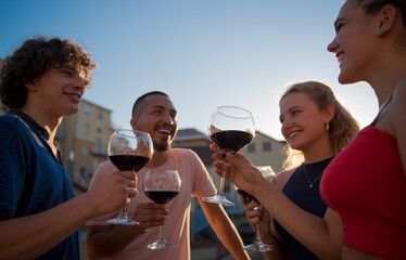 Party in Italy, young boys toast.