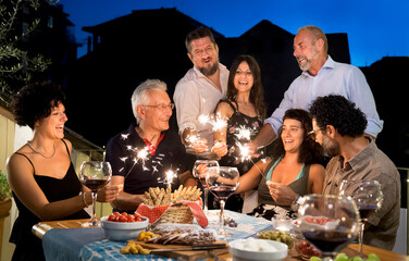 Party in Italy, adults toast with a glass of wine