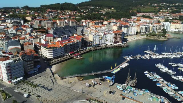 Aerial view in beautiful harbor with boats in summer. Spain. Drone Video