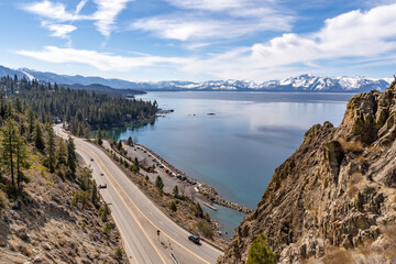 highway next to a mountain lake (Lake Tahoe)