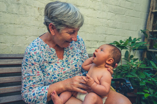 Grandmothjer holding baby grandchild