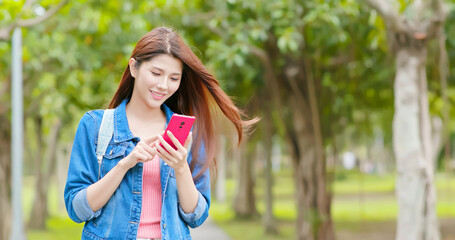 woman use smartphone in park