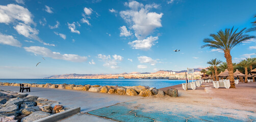 Naklejka na ściany i meble Promenade and sandy beach in Eilat – southernmost Israeli tourist resort, Red Sea 