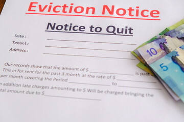 Obraz premium Eviction notice with Cash Canadian Dollars to pay outstanding