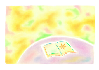 テーブルの上に本があり、カエデのはが乗っている、バックは秋のイメージのきれいな色