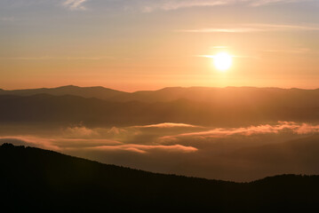 sunrise mountains sun fog clouds sky