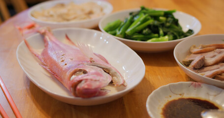 Hong Kong style home cuisine, family dinner concept, steamed fish, fry vegetable and meat
