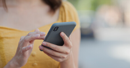 Woman use of mobile phone in city