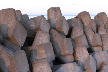 Close-up of pile of concrete tetrapod blocks