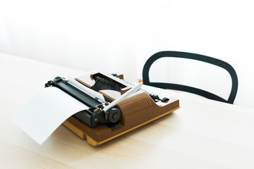 Old typewriter on the table with nobody, concept of working at home