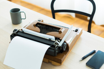 Old typewriter on the table with nobody, concept of working at home