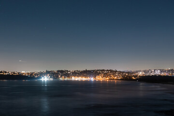 Bright city light across the beach.