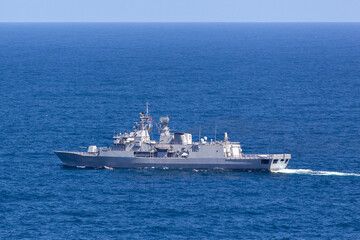 Warship sailing in the open ocean.