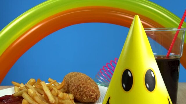 French fries with Kiev cutlet with red sauce appear on a blue background