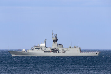 Naval vessel sailing at sea.