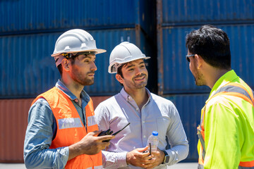 Engineer and foreman worker working checking at Container cargo harbor to loading containers.