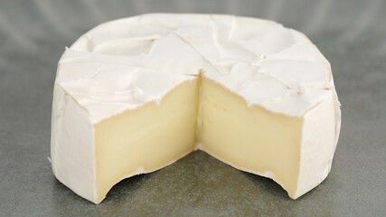 cheese Camembert or brie. Delicious pieces of white mold cheeses with soft textures Camembert close up
