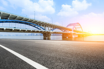 Asphalt road and viaduct with river in hangzhou,China.