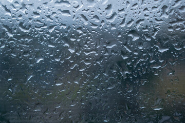 Summer rain drops on glass.