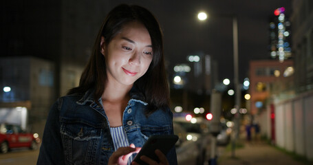 Woman use of mobile phone at street
