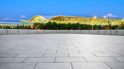 City square floor and airport buildings at night in Shanghai,China.